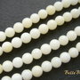(10 b) Coral alb - galbui aprox 4 mm