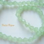 Cristale biconice de aprox 4 mm verde deschis  mat (10 bucati)