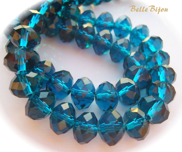 Cristale din sticla fatetate albastru marin aprox 10x8 mm