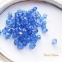 (10 b) Cristale biconice albastre din acril aprox 5 mm