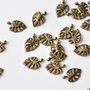 Charm frunza  exotica  nuanta bronz antic