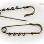 Baza brosa finisaj bronz cu 4 bucle aprox  58x19mm