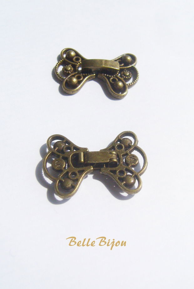 Inchizatoare ornamentala finisaj bronz aprox 16x22 mm