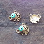 Charm elefantel aurit, evil eye 17x15mm (GPLAK 122)