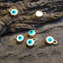 1b charm aurit evil eye alb 10x7mm (GPLAK 138)