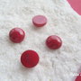 Cabochon rosu inchis din pasta de coral aprox 5x10 mm