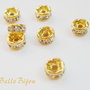 Distantiere rhinestone aurii de diametru aprox 4 mm cu cristale culoare cristal-clear