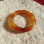 Donnut din agata in nuante de carneol de grosime aprox 5.5 mm si diametru aprox 35.5 mm
