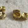 Distantiere rhinestone aurii de diametru aprox 6 mm cu cristale culoare cristal-clear