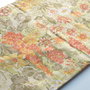 Material textil inflorat