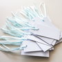 Lot etichete albe cu panglica bleo aqua. Price tags.