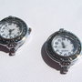 Ceas finisaj argintiu aprox 27x33 mm