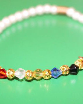 bratara din perle tip mallorca cu cristale biconice colorate si un charm cruciulita din turcoaz