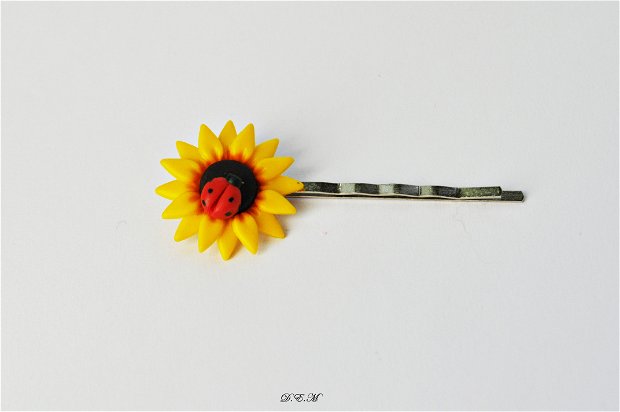 Agrafa de par Floarea-soarelui