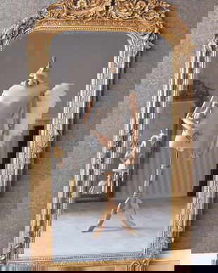 Oglinda baroc din cristal cu o rama aurie antichizata cu decoratiuni