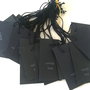 Price tags. Etichete negre cu mesajul Made by hand.