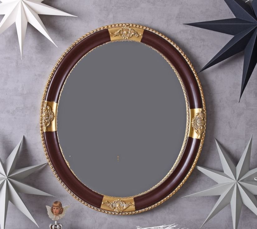 Oglinda rotunda cu o rama aurie cu negru