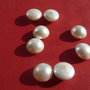 Perla alba tip Mallorca usor matuita semi-gaurita aprox 14x8 mm