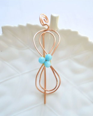 Accesoriu de prins parul