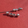 Margica de aprox 3 mm din argint .925 rodiat gravata in spirala