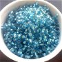 Margele nisip blue deschis transparent cu miez argintiu 4 mm 50 g.