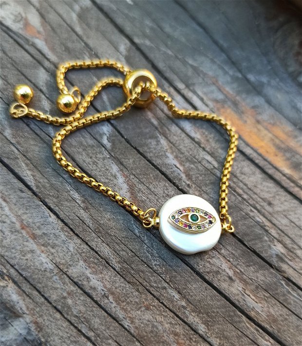 Bratara din inox auriu cu perla acrilica cu ochi din alama, decorat cu zirconii