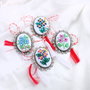 Brosa  , martisor cu broderie manuala - motive florale  pe panza taraneasca