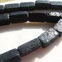 Paralelipiped usor rotunjit la colturi din lava neagra aprox 8x12x22.5 mm
