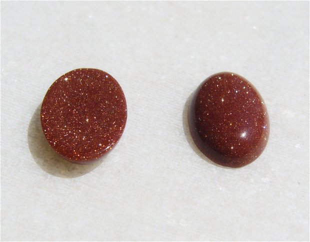 (2 bucati) Cabochon oval din brown goldstone aprox 14x10x4 mm