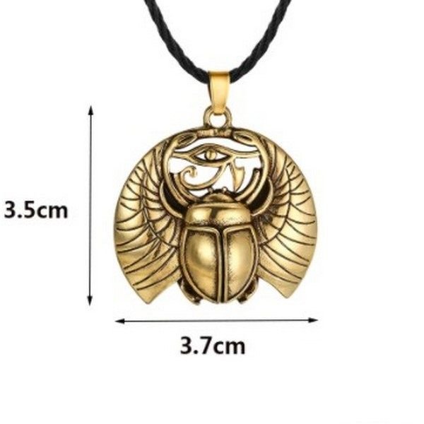 K1191 - Pandantiv, scarabeu, ochiul lui Horus, aliaj metalic aspect auriu antichizat, 37x35mm, snur textil 45+5cm