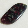 Cabochon eudialit (INDIA - lucrat manual) aprox 34x15x3.5 mm