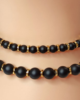 Brățară reglabilă unisex, realizată cu Onix negru si Hematit auriu.