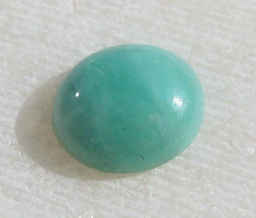 Cabochon oval mic din smarald aprox 6.5x5.5x2.5 mm