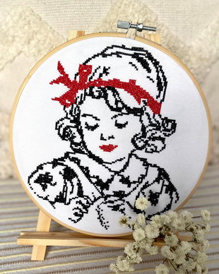 Broderie manuala pe gherghef