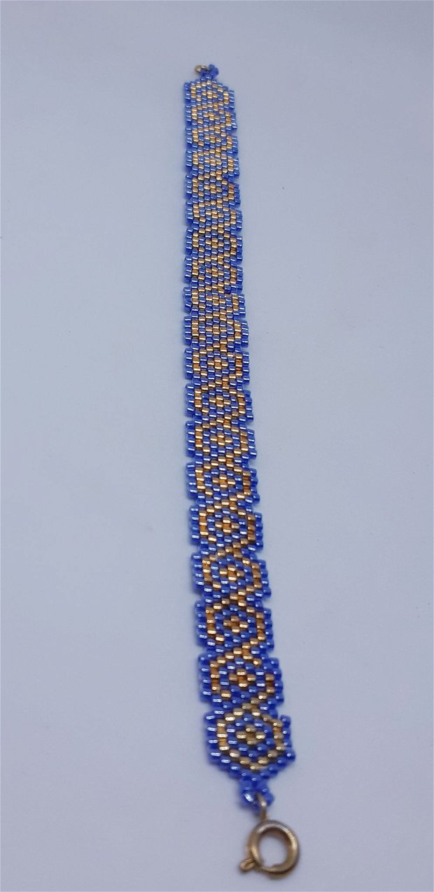 Bratara tip manseta, cu model geometric,  din margele japoneze albastre si auriu metalic