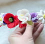 Coronita: Maci, liliac, flori de măr, margarete