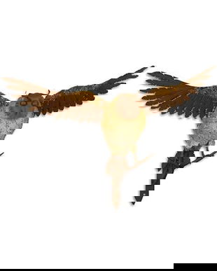 Bufnita pe o creanga-decoratiune din fonta