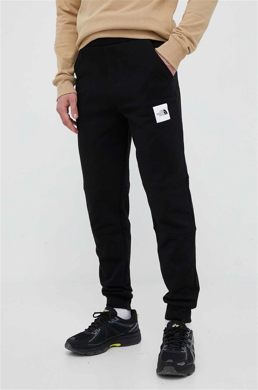The North Face pantaloni de trening din bumbac culoarea negru, cu imprimeu