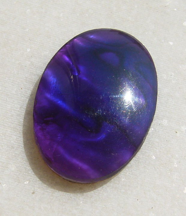 Cabochon din scoica paua abalone naturala acoperita cu un strat protector din rasina aprox 30x20x5 mm