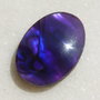 Cabochon din scoica paua abalone naturala acoperita cu un strat protector din rasina aprox 30x20x5 mm