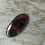 Cabochon ochi de tigru rosu, 26x13 mm