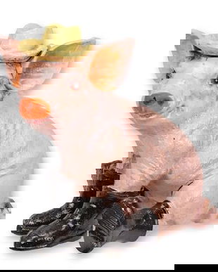 Purcelus cu cizme-figurina din fonta