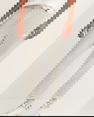 adidas pantaloni de trening Essentials culoarea bej, cu imprimeu, JE6317