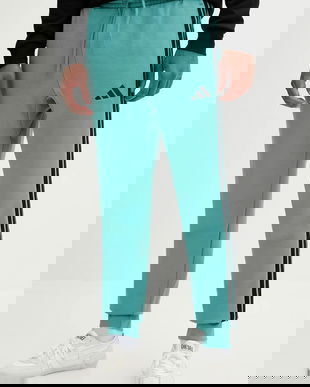 adidas pantaloni de trening Essentials culoarea turcoaz, cu imprimeu, JX0711