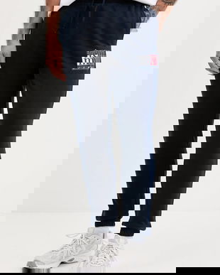 Tommy Jeans pantaloni de trening din bumbac culoarea albastru marin, cu imprimeu, DM0DM22094