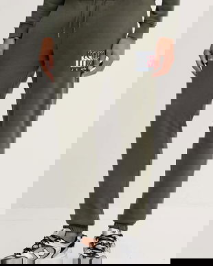 Tommy Jeans pantaloni de trening din bumbac culoarea verde, cu imprimeu, DM0DM22094