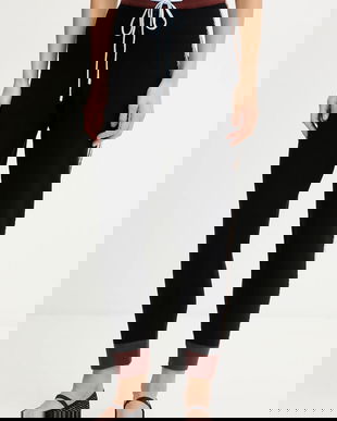 Never Fully Dressed pantaloni de trening culoarea negru, cu imprimeu, NFDKN710