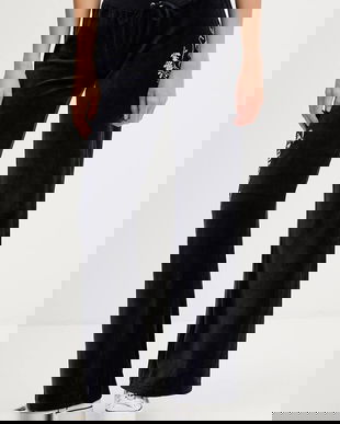 Juicy Couture pantaloni de trening din velur culoarea bleumarin, cu imprimeu, JCGBJ225010