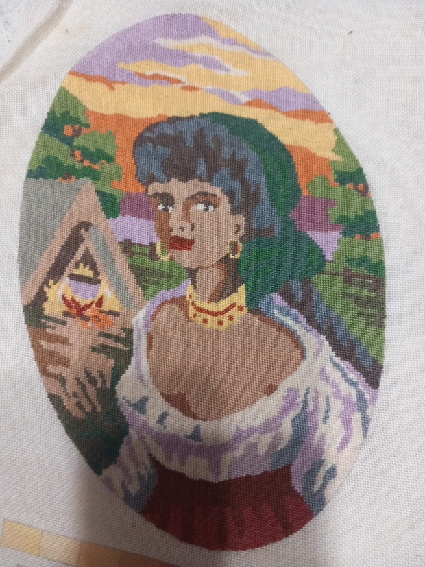 Vând un goblen lucrat manual, reprezentând un portret delica