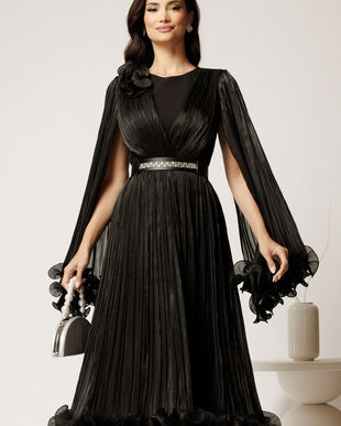 Rochie midi neagra din voal satinat in clos cu floare la bust si curea din strasuri in talie